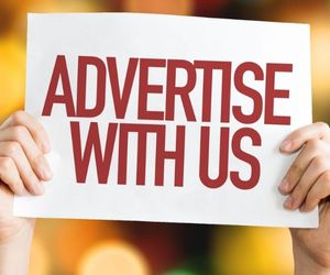 Advertise with us sign held by hands