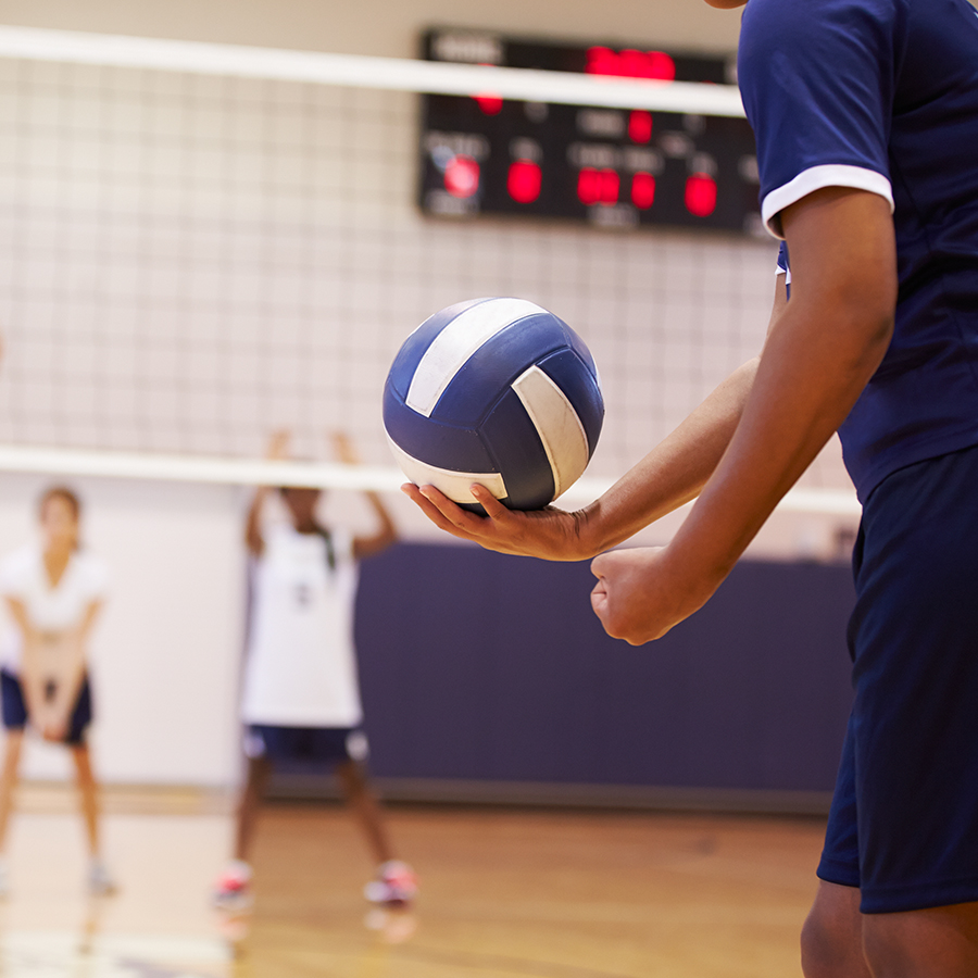 images of man serving a volleyball during a game